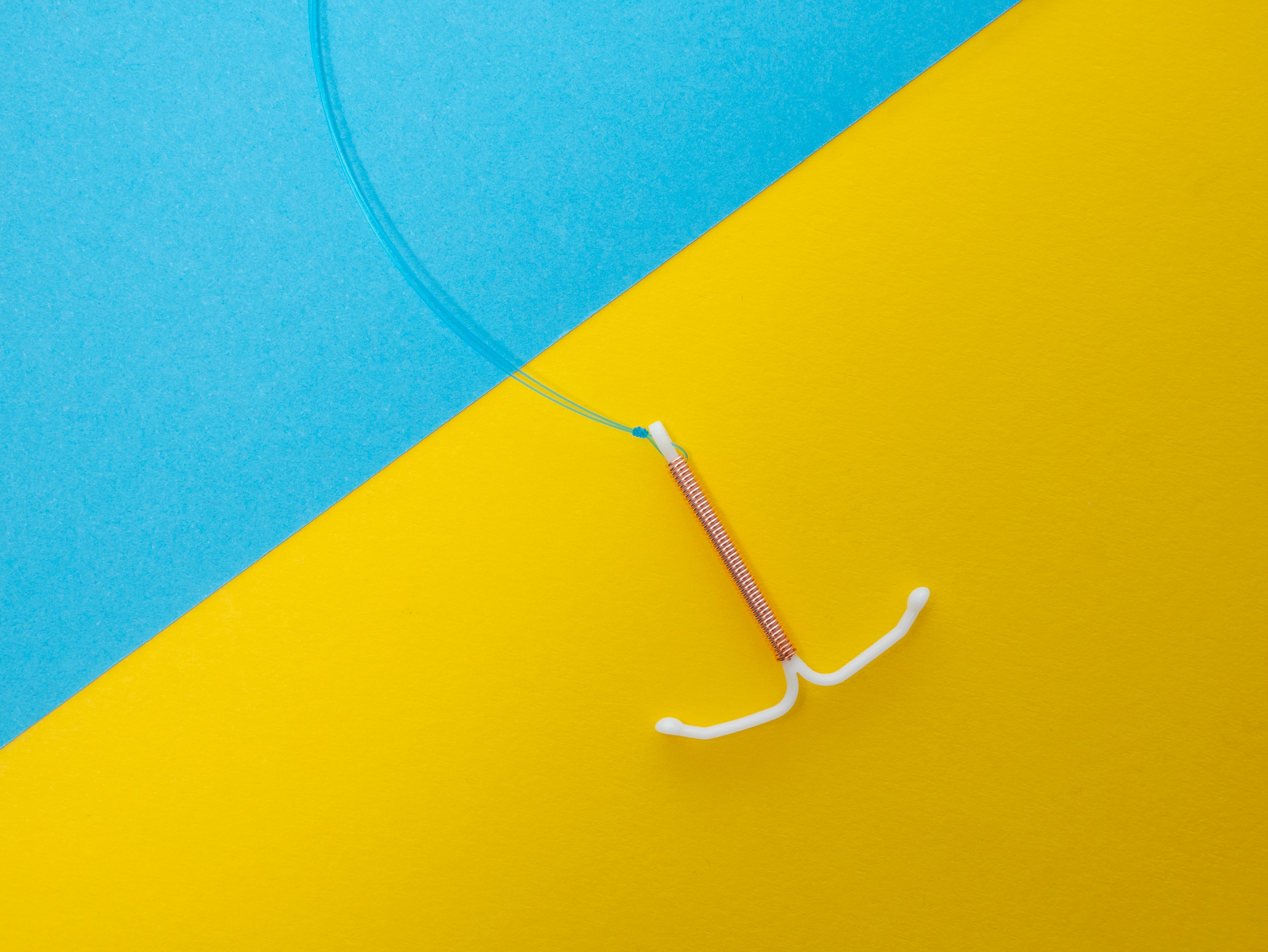 IUD on yellow blue background